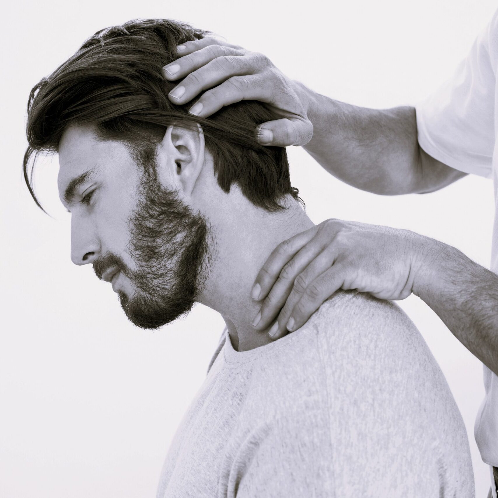 Doctor examining disc condition Doctor examining a male patient with disc condition problems to make a treatment plan