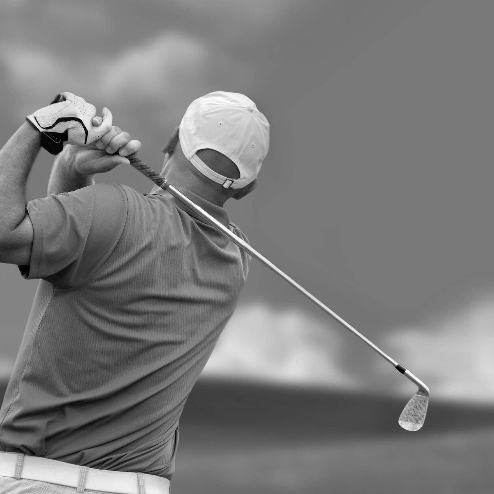 A male golfer hitting the perfect drive